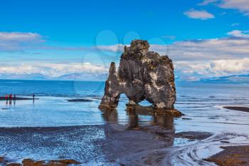 Stone mammoth Iceland. Remains of an ancient extinct volcano Hvitserkur on the sea shelf