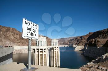 Royalty Free Photo of a No Pets on Top of Dam Sign