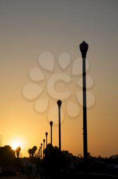 Royalty Free Photo of Lampposts at Sunset