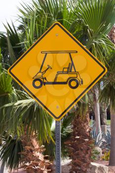 Royalty Free Photo of a Golf Car Crossing Sign