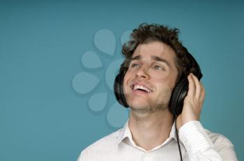 Royalty Free Photo of a Man Listening to Headphones