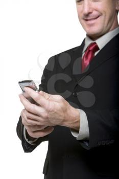 Royalty Free Photo of a Man Looking at a Cell Phone