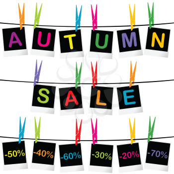 Autumn sale concept with photo frames hanging on clothespins