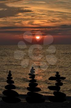 Relax zen stones balanced. Black pebbles at sunris
