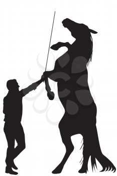 Black silhouette of man training a horse to rearing up