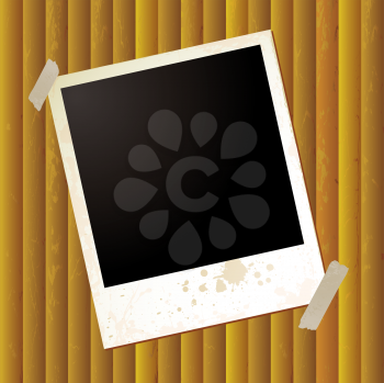 Royalty Free Clipart Image of a Photograph Taped on a Rippled Background