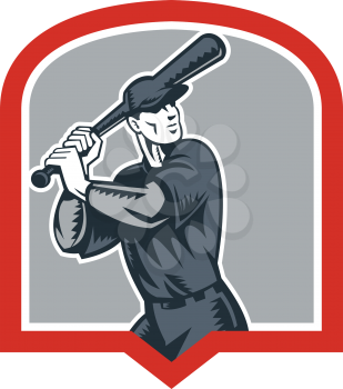 Illustration of a american baseball player batter batting set inside shield crest shape done in retro woodcut style isolated on white background.