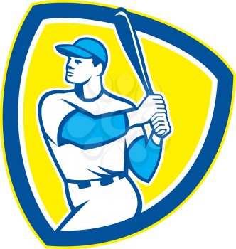 Illustration of an american baseball player batter hitter holding bat set inside shield crest on isolated background done in retro style. 