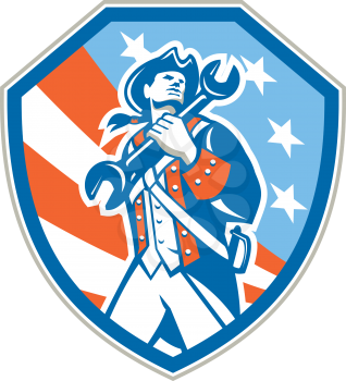 Illustration of an american mechanic patriot holding wrench spanner set inside shield with usa stars and stripes in the background done in retro style.