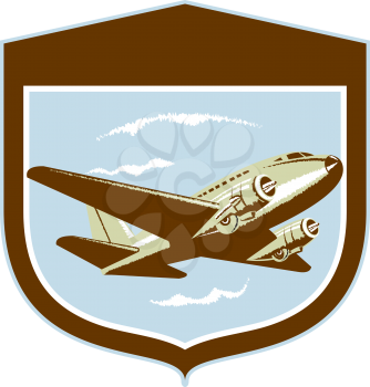 Illustration of a DC10 propeller airplane airliner on flight flying set inside shield crest shape on isolated background done in retro style.