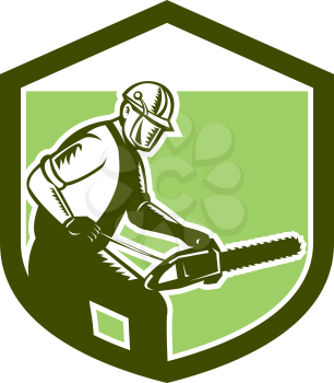 Illustration of arborist tree surgeon lumberjack holding a chainsaw set inside crest shield on isolated white background done in retro woodcut style. 