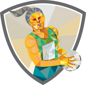 Low polygon style illustration of a netball player holding ball viewed from front set inside shield crest on isolated white background.