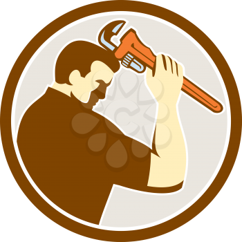 Illustration of a plumber holding monkey wrench viewed from side set inside circle on isolated background done in retro style. 