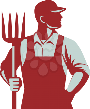 Illustration of organic farmer holding pitchfork looking to the side with one hand in pocket viewed from front  set on isolated white background done in retro style. 