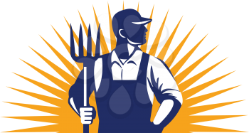 Illustration of organic farmer holding pitchfork looking to the side with one hand in pocket viewed from front with sunburst in the background done in retro style. 