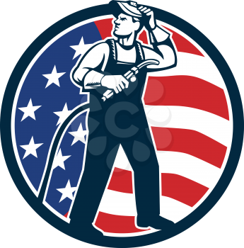 Illustration of welder worker standing with visor up looking to the side holding welding torch with tank viewed from front set inside circle with usa american stars and stripes flag in the background 