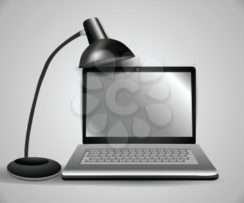 Royalty Free Clipart Image of a Laptop and Lamp