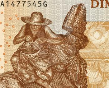 Royalty Free Photo of a Man Weaving Basket on 500 Ariary 2004 Banknote from Madagascar.