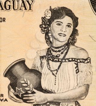 Royalty Free Photo of Paraguayan Woman Holding Jug on 5 Guarani 1963 Banknote from Paraguay