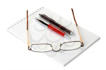 Royalty Free Photo of a Blank Notebook, Pens and Glasses