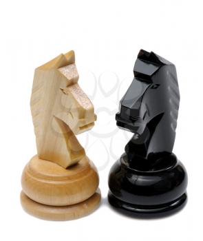 Royalty Free Photo of Two Chess Knights in Light and Dark Wood