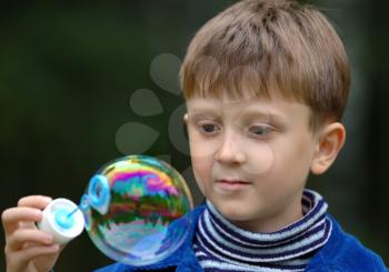 Royalty Free Photo of a Child With a Bubble