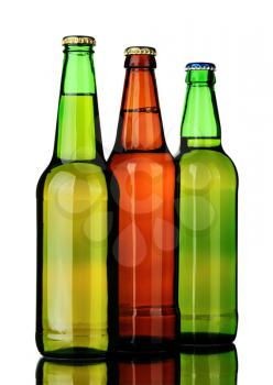 Bottles of lager and beer from brown and green glass, isolated on a white background.