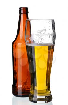 Glass of beer and bottle, isolated on a white background.
