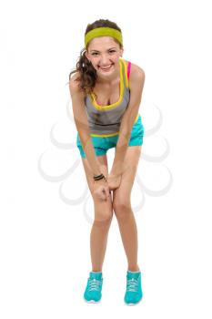 Sports girl in shorts and a t-shirt on a white background, isolated.
