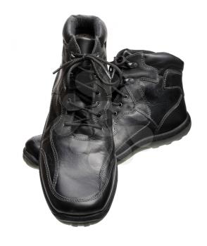 Men's black leather shoes with laces, isolated on a white background.