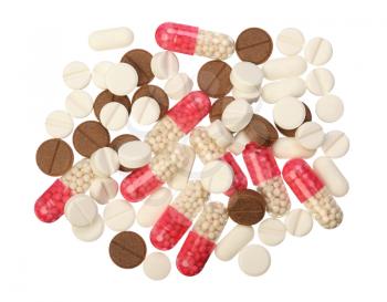 Several white, red and brown pills on a white background, isolated