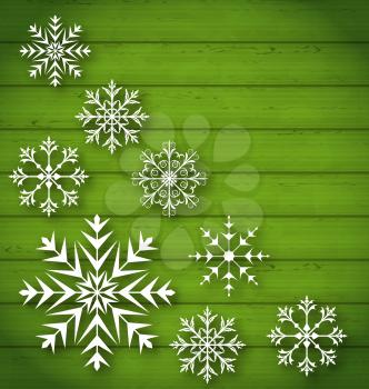 Illustration set geometric snowflakes on wooden background - vector