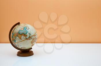 Royalty Free Photo of a Globe on a Desk