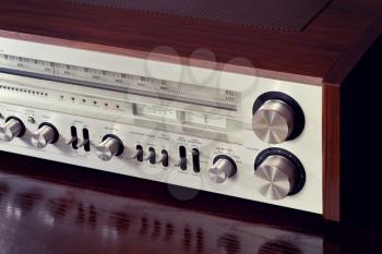 Vintage Analog Retro Stereo Radio Receiver Shiny Front Panel Angled View