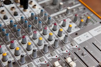 Audio studio sound mixer equalizer board controls, top view closeup