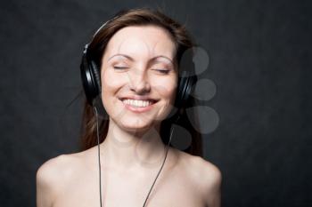 woman with headphones listening to music closed eyes