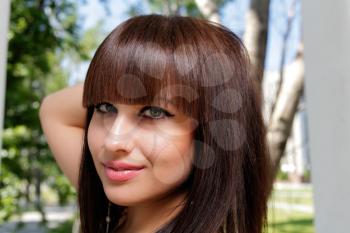 Outdoor portrait of a beautiful young brunette Caucasian woman