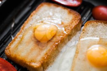 Frying pan with eggs. Breakfast for two.