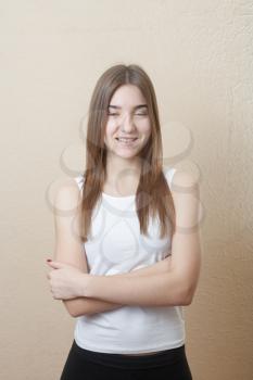 pretty yound slim woman smiling torso shot on white background in sport form indoors health concept