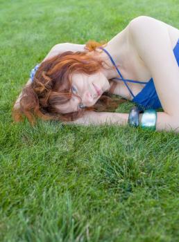 redhead on grass, copyspace
