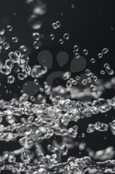 Levitation of water drops on black