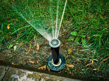 Automatic watering system in the park working.