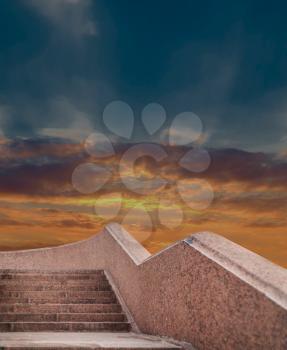 Steps leading up in front of sunset sky. Path Way to God and Heaven maybe.