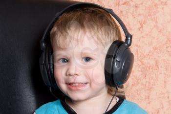 Royalty Free Photo of a Boy Wearing Headphones
