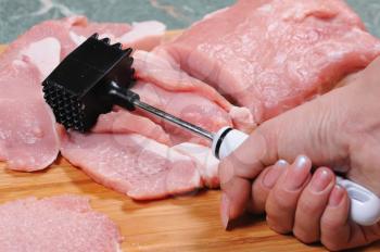 Royalty Free Photo of a Person Preparing Meat