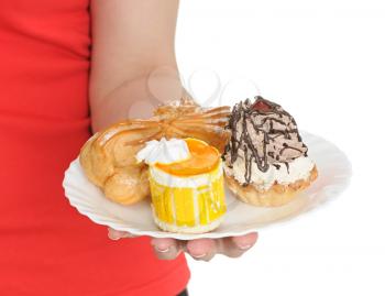 Royalty Free Photo of a Person Holding a Plate of Desserts