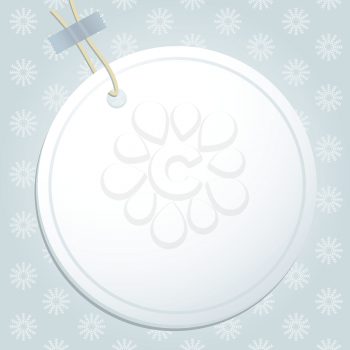 White label and string on a blue snowflake background