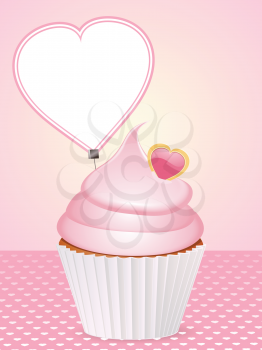 pink cupcake with heart shaped message label on a pink background