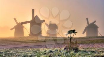 Royalty Free Photo of Windmills in the Fog