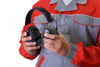 Royalty Free Photo of a Man Holding Protective Headphones